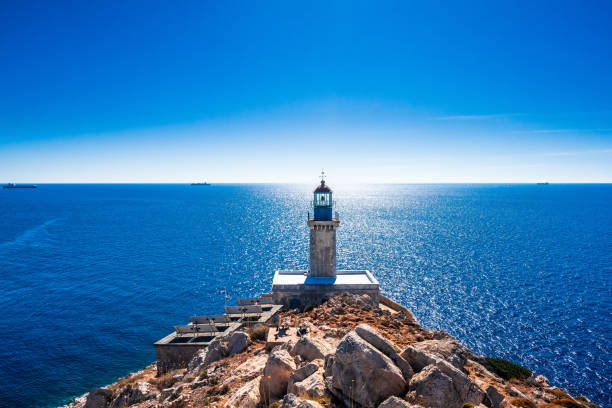 lighthouse at cape tainaron lighthouse in mani peloponnese, the southernmost point of mainland greece - deniz seviyesi stok fotoğraflar ve resimler