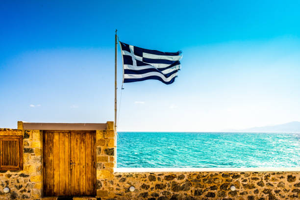 view on scenic view of sea against sky and greek flag - ocean scenic flash imagens e fotografias de stock