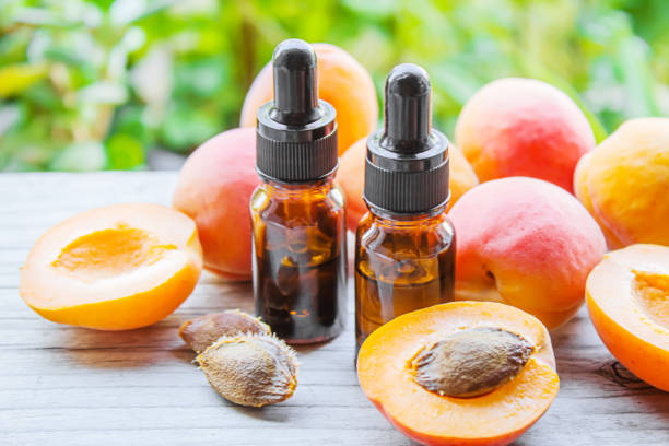 istock Apricot kernel oil in a bottle. Selective focus. 1334687279