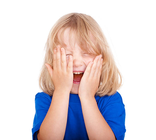 istock boy with long hair laughing 133468744