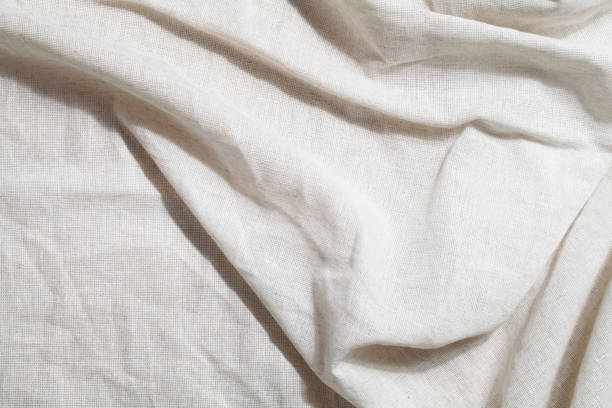 istock crumpled linen textile with shadow. Organic Eco material. Minimalistic cozy light background. kinfolk design 1334691871