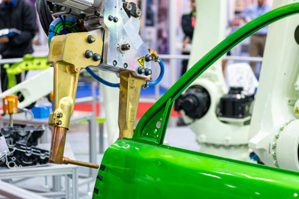 istock electrode resistance spot welding with robot during simulated position point arc or spark for assembly body frame door automobile part in manufacturing process 1334693333