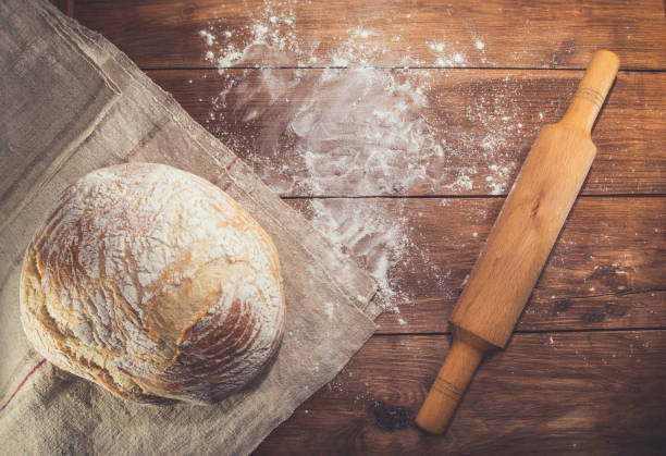 istock Assorted homemade healthy bread on rustic wooden background 1334694721