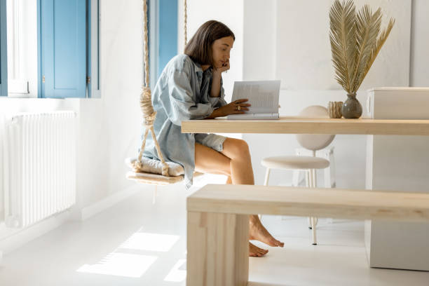 istock Woman having leaisure time at comfortable home 1334694741