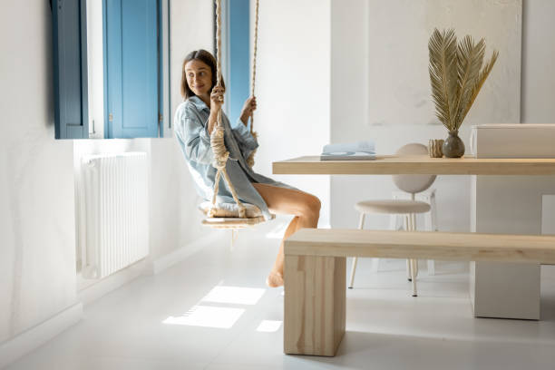 istock Woman having leaisure time at comfortable home 1334694751