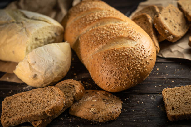 istock Assorted homemade healthy bread on rustic wooden background 1334694874