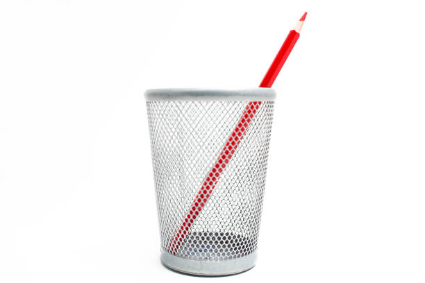 istock Red pencils in case on white background 1334695825