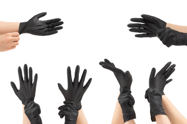 istock Woman puts on black rubber gloves. 1334697270