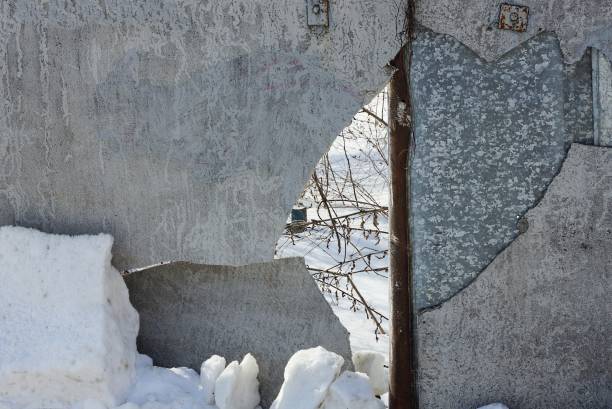istock part of a gray broken slate fence wall with cracks 1334697383