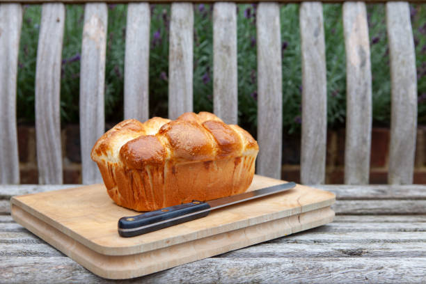 Fresh brioche bread on a wooden chopping board