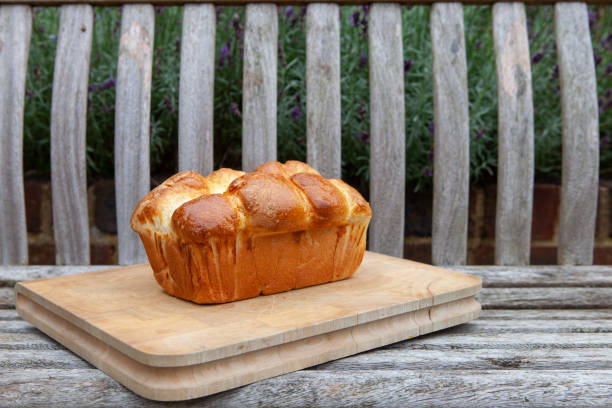 istock Fresh brioche bread on a wooden board 1334699725