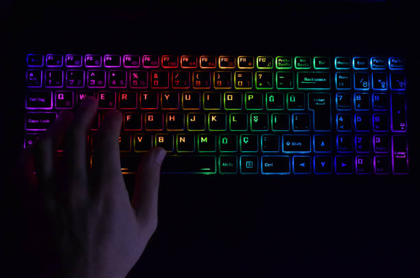 istock colorful keyboard with human hand 1334705587