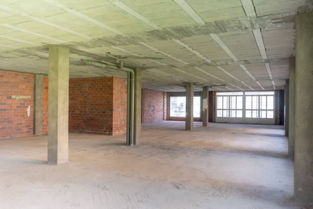 Wide-angle background image of an empty building under construction with concrete columns. stock photo