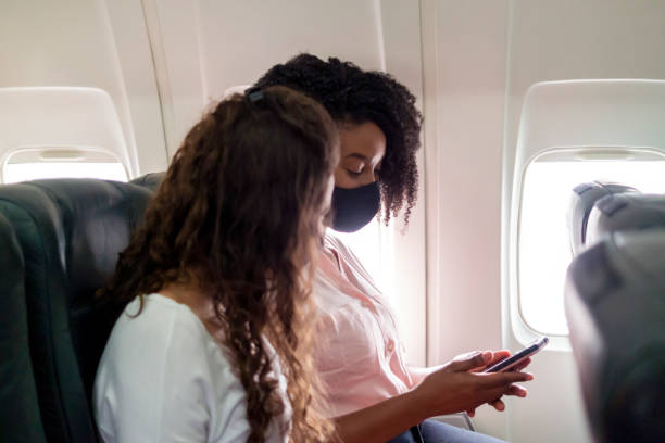 istock Two young women flying 1334708839