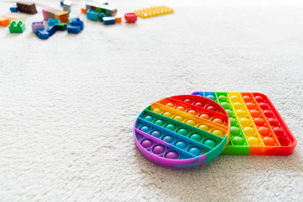 istock Modern trendy toy Pop it for children with flexible silicone material 1334714405