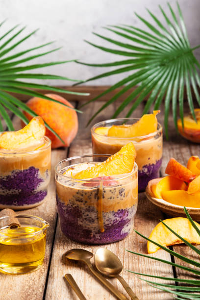 istock Blueberry chia pudding with caramel and peaches in glass jars. 1334716595