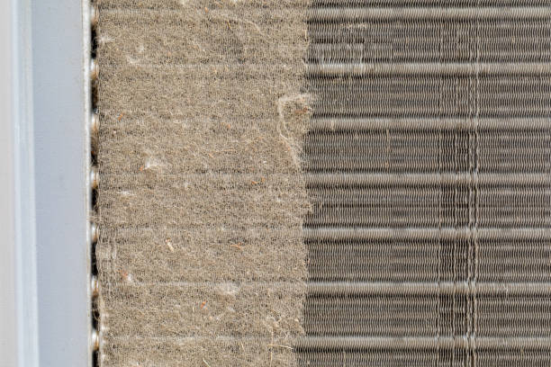 dirty air conditioning unit. condenser coil full of dirt and grass debris. concept of home air conditioning, hvac, repair, service, cleaning and maintenance. - condenser imagens e fotografias de stock