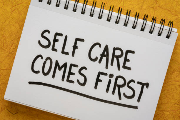istock self care comes first inspirational reminder - handwriting in a sketchbook 1334716932