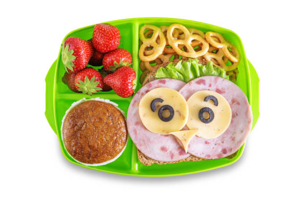 istock Kid's healthy breakfasts with funny faces in a container on a white isolated background 1334717776