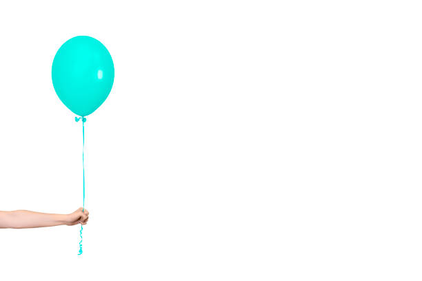 istock Hand hold blue balloon. Party or present concept. Blue Balloon and hand isolated on white background. Banner with copy space 1334723521