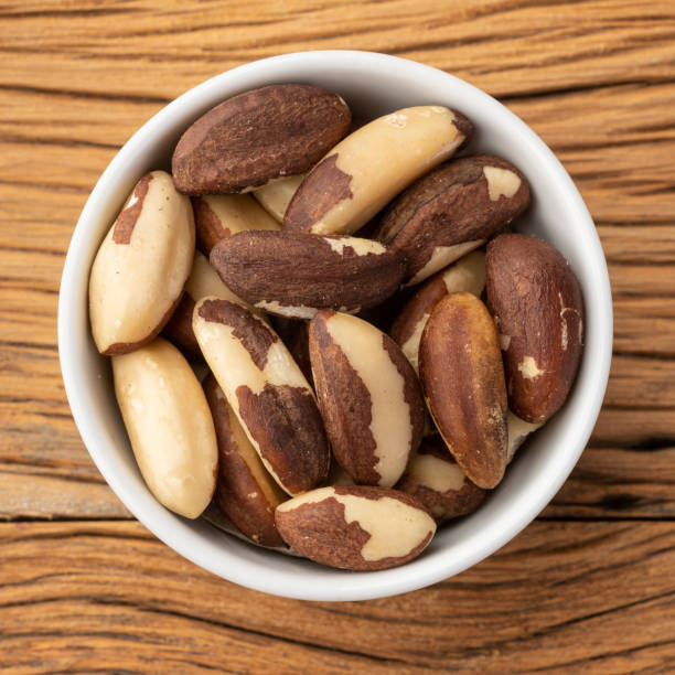 istock Brazil nuts in a bowl over wooden table 1334725421