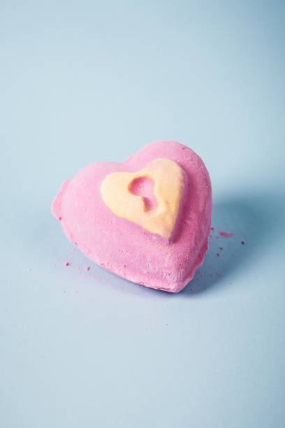 istock Pink heart shaped bath bomb with yellow lock 1334729511