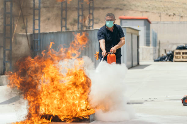 People in the extinguisher training program People in the extinguisher training program emergency services equipment stock pictures, royalty-free photos & images