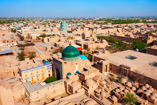 Pakhlavan Makhmoud Mausoleum at Ichan Kala, Khiva Pakhlavan Makhmoud Mausoleum aerial panoramic view at the Ichan Kala, an ancient walled inner town of the city of Khiva in Uzbekistan khiva stock pictures, royalty-free photos & images