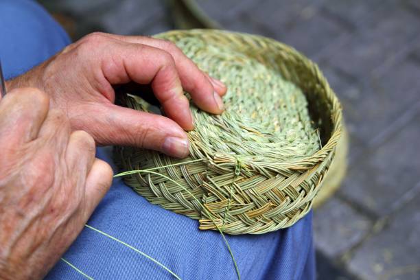istock craftsman sewing basket esparto grass weaver 1334745166