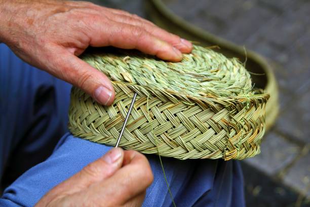 istock craftsman sewing basket esparto grass weaver 1334745170