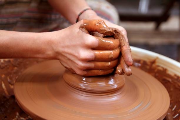istock clay potter hands closeup working on wheel handcrafts 1334745205
