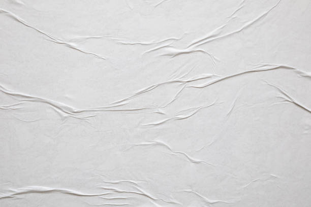 istock Blank white crumpled and creased paper poster texture background 1334748330