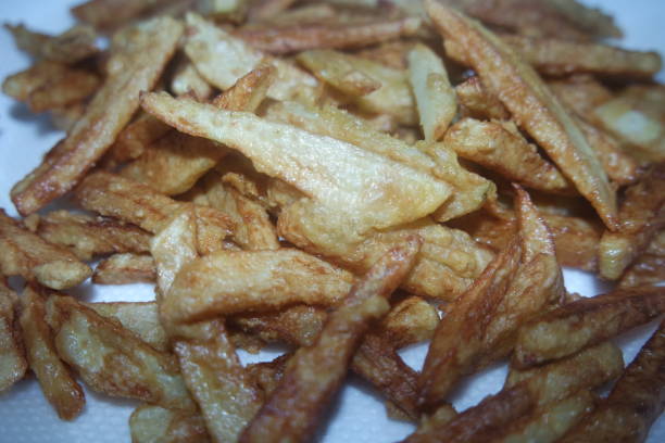 istock Potato fried or roasted slices on clean background with copy space for text 1334748338