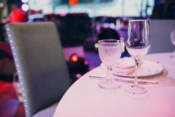istock beautiful shape empty wine glass on table in restaurant decor 1334748411