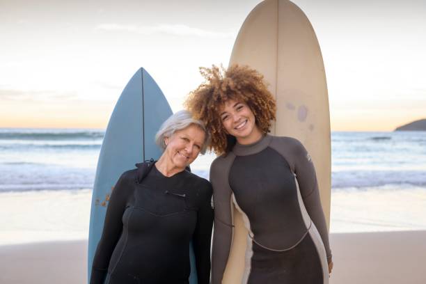 istock New friends go surfing together 1334748468