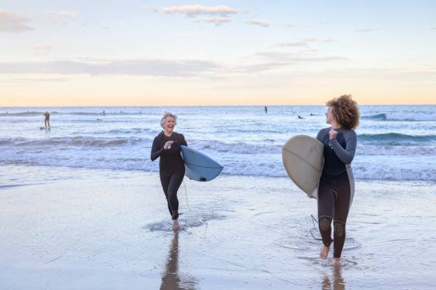 istock Senior woman learns to surf 1334748470