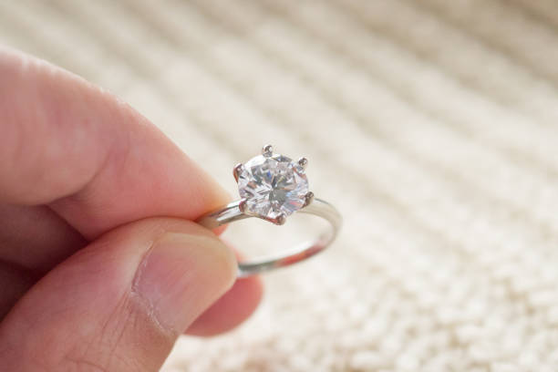istock hand hold beautiful jewelry diamond ring 1334748492