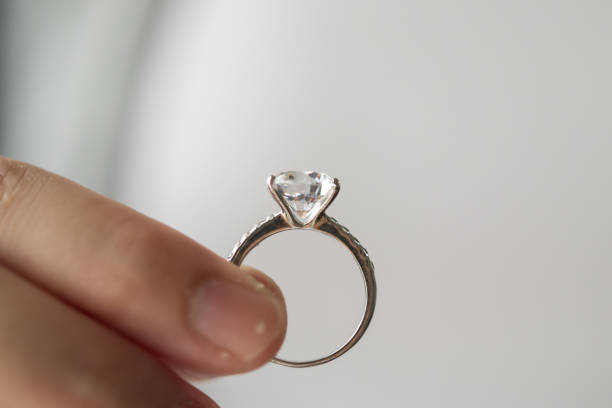 istock hand hold beautiful jewelry diamond ring 1334748555