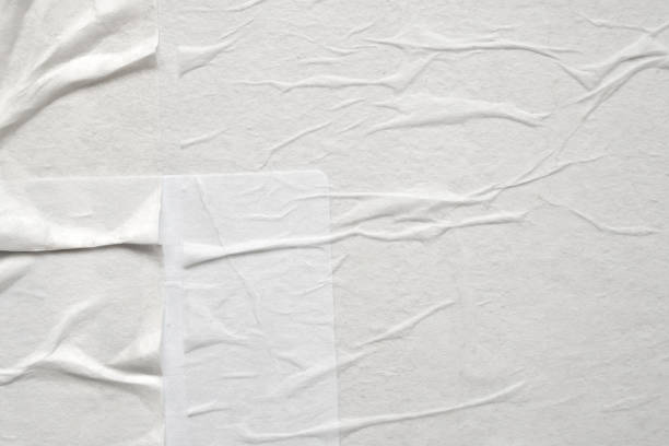 istock Blank white crumpled and creased paper poster texture 1334749156
