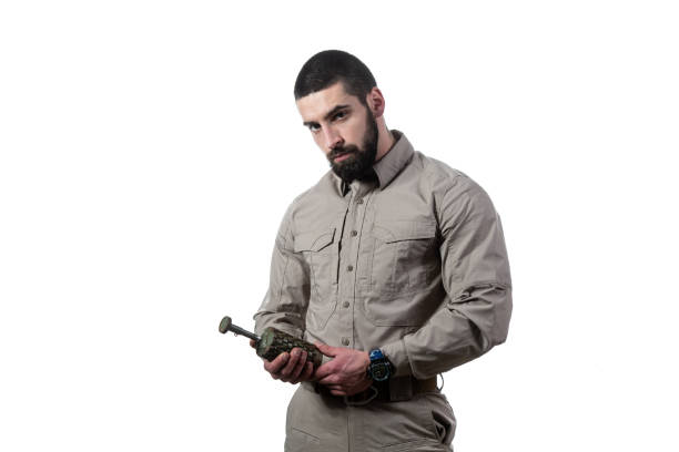 istock Man Holding a Bomb in His Hand 1334749933