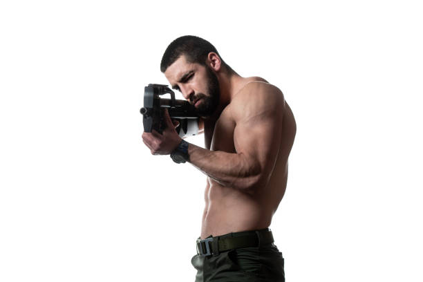 istock Bodybuilder Soldiers With Gun on a White Background 1334750041