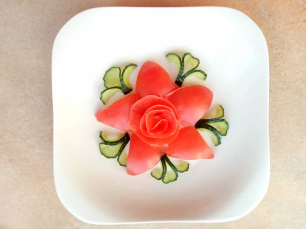 High angle shot of a bowl full of pretty pink flowers