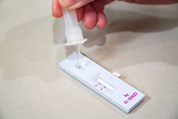 istock Positive test result by using rapid test for COVID-19, quick fast antibody point of care testing.Swab in the hospital laboratory 1334759087