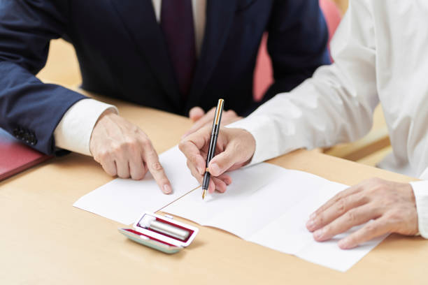 Hands of elderly people who consult with the profession about inheritance and wills Hands of elderly people who consult with the profession about inheritance and wills probate stock pictures, royalty-free photos & images