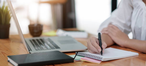 istock E-learning ,online ,education and internet social distancing protect from COVID-19 viruses concept. Asian woman student video conference e-learning with teacher on laptop computer at home. 1334759653