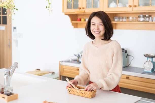 istock attractive asian woman relaxing,kitchen 1334763205
