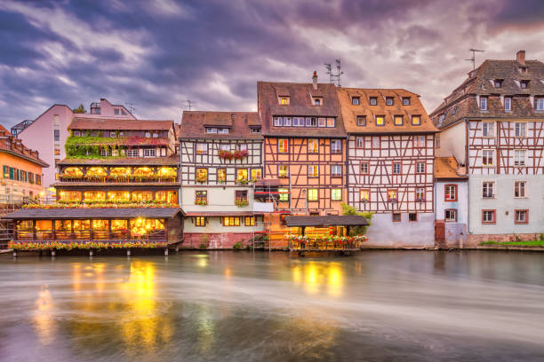 Half timbered facades in Petite France district, Old Town Strasbourg, Alsace, France at night.