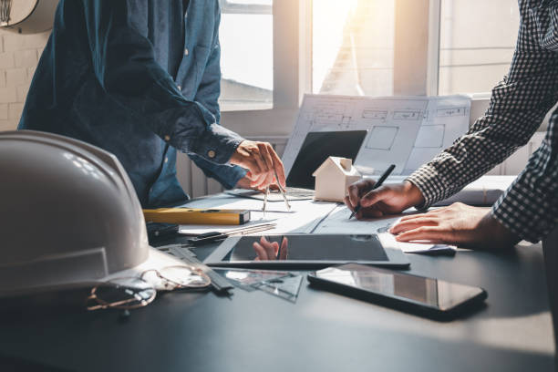 istock Image man architect Brainstorming ideas to design a house at the office. 1334765066