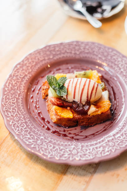 istock French toast with vanilla ice cream and fruit 1334773049
