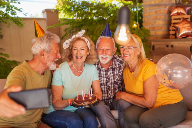 istock Senior people taking a selfie at birthday party 1334777611